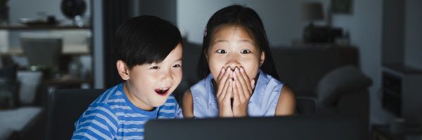Shocked kids at laptop
